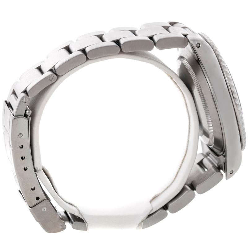 The image shows the side profile of a Rolex Submariner 14060 Men
s Stainless Steel Black Dial 14060 Men
s Stainless Steel Black Dial watch, highlighting the bracelet and case side.