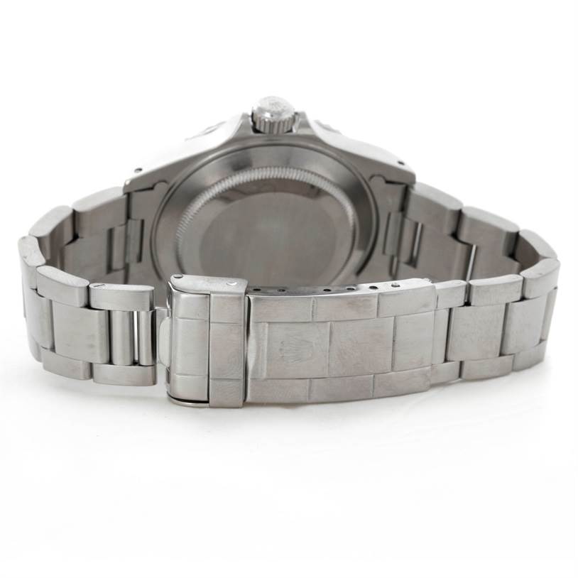 The image shows the rear view of a Rolex Submariner 14060 Men
s Stainless Steel Black Dial 14060 Men
s Stainless Steel Black Dial watch, highlighting its case back and bracelet clasp.