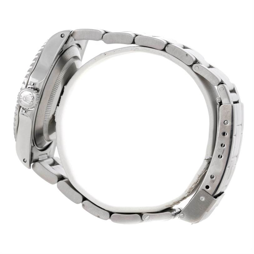 This image shows a side profile of a Rolex Submariner 14060 Men
s Stainless Steel Black Dial 14060 Men
s Stainless Steel Black Dial watch, highlighting its crown, case, and bracelet.