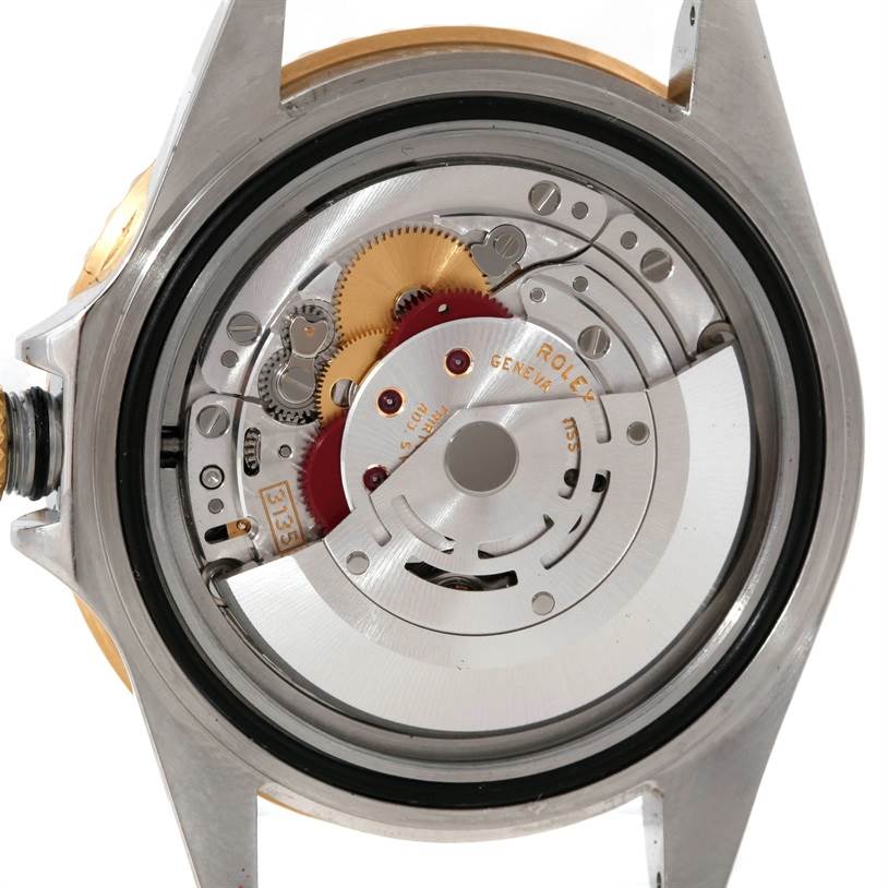 The image shows the internal mechanism of a Rolex Submariner 16613 Men's Steel and Gold (two tone) Black Dial 16613 Men's Steel and Gold (two tone) Black Dial watch, viewed from the back with its case removed.
