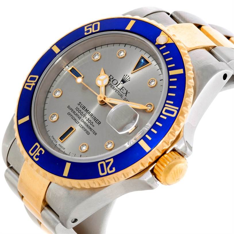The image shows a close-up, angled view of the Rolex Submariner 16613 Men's Steel and Gold (two tone) Grey Dial 16613 Men's Steel and Gold (two tone) Grey Dial watch, highlighting the dial, bezel, crown, and part of the bracelet.