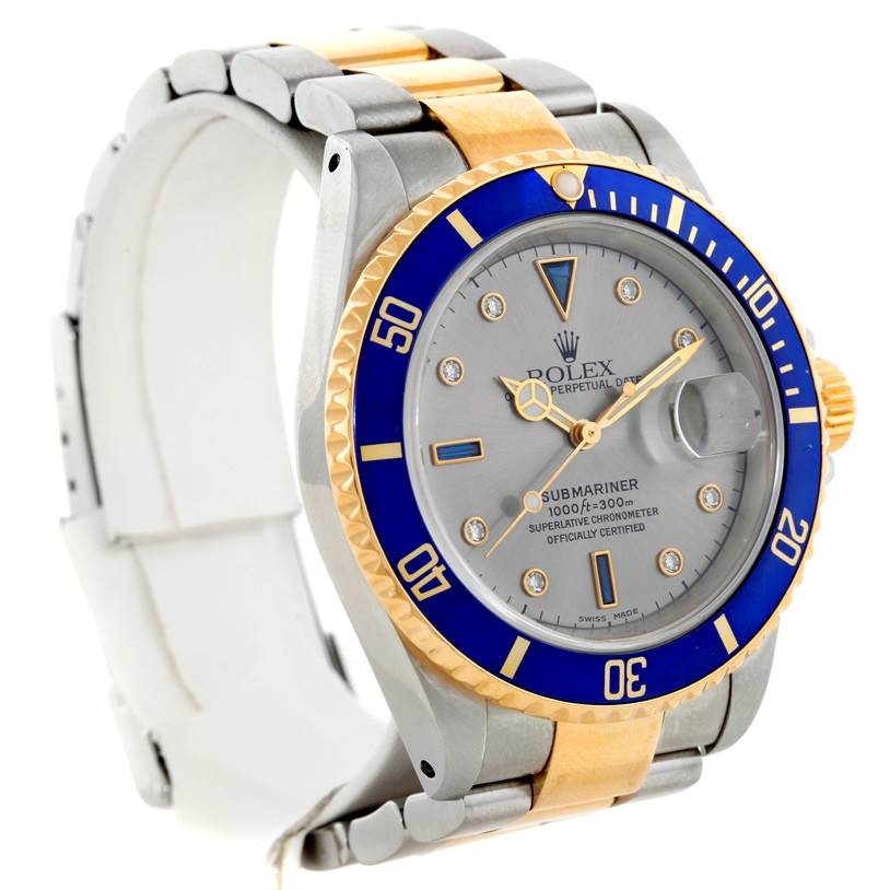 The image shows a Rolex Submariner 16613 Men's Steel and Gold (two tone) Grey Dial 16613 Men's Steel and Gold (two tone) Grey Dial watch at an angled view highlighting the face, bezel, and part of the bracelet.