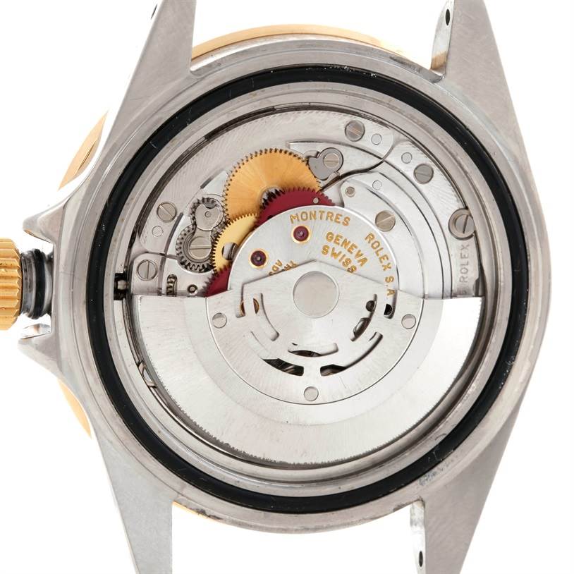 The image shows the internal mechanism of a Rolex Submariner 16613 Men's Steel and Gold (two tone) Grey Dial 16613 Men's Steel and Gold (two tone) Grey Dial watch, viewed from the back without its case back.