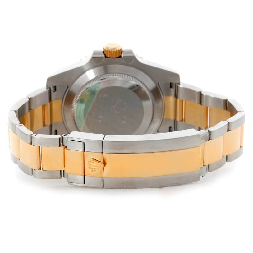 The image shows the back view of a Rolex Submariner 116613 Men's Steel and Gold (two tone) Blue Dial 116613 Men's Steel and Gold (two tone) Blue Dial watch, highlighting its case back and bi-metal bracelet.