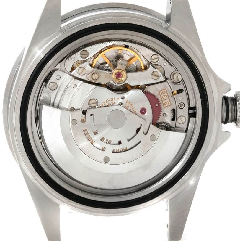 This image shows the back view of a Rolex Submariner 16610 Men
s Stainless Steel Black Dial 16610 Men
s Stainless Steel Black Dial watch, highlighting its intricate mechanical movement.