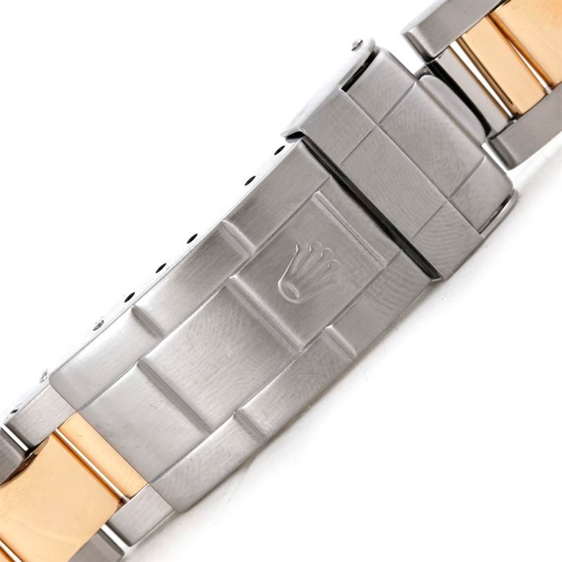 This image shows a close-up of the clasp and bracelet of a Rolex Submariner 16613 Men's Steel and Gold (two tone) Blue Dial 16613 Men's Steel and Gold (two tone) Blue Dial watch.