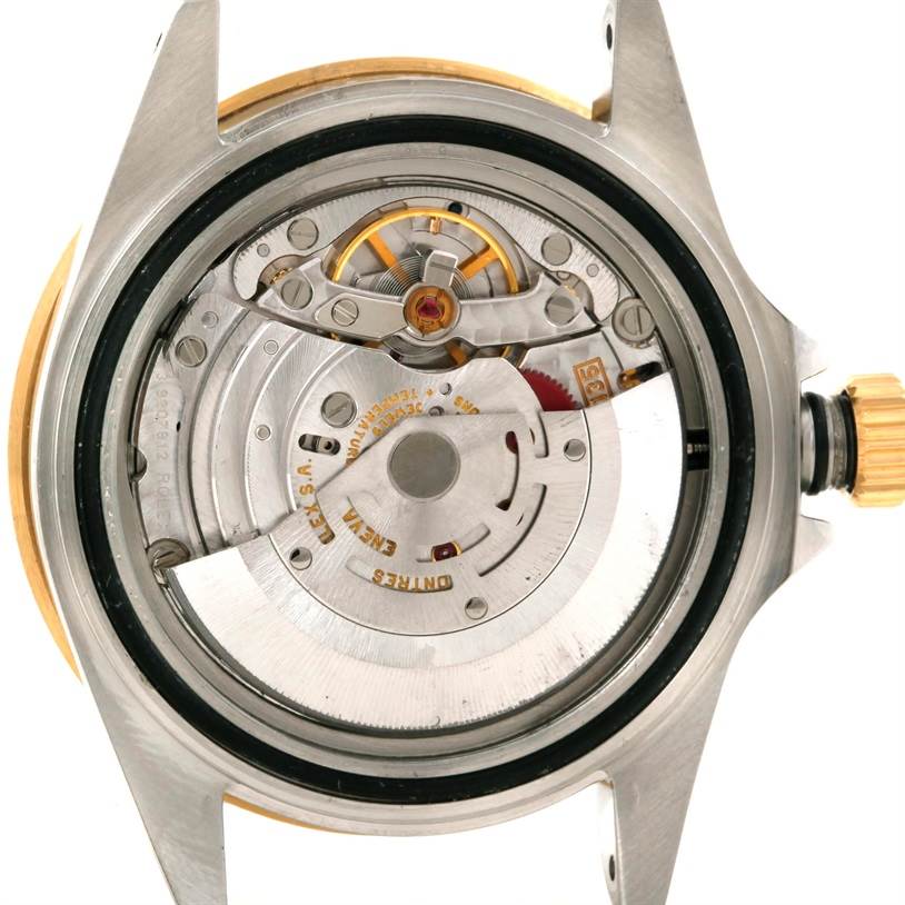 The image shows the back view of the Rolex Submariner 16613 Men's Steel and Gold (two tone) Blue Dial 16613 Men's Steel and Gold (two tone) Blue Dial watch, revealing its internal mechanical components.