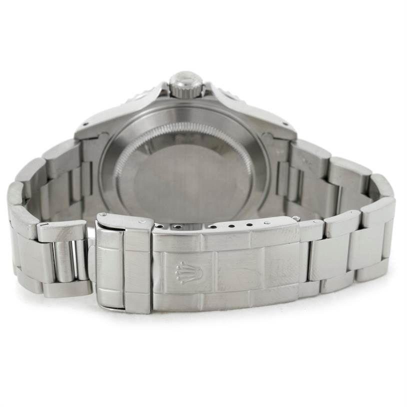 This image shows the back case and metal bracelet clasp of a Rolex Submariner 14060 Men
s Stainless Steel Black Dial 14060 Men
s Stainless Steel Black Dial watch from a rear angle.