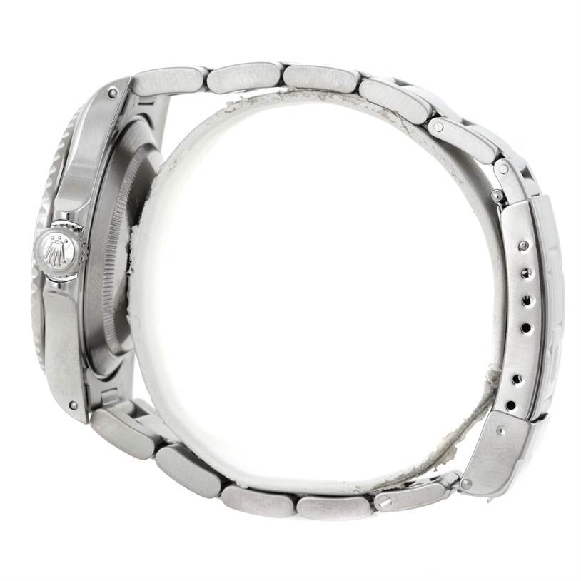 This side view of the Rolex Submariner 14060 Men
s Stainless Steel Black Dial 14060 Men
s Stainless Steel Black Dial watch shows the bracelet and crown.