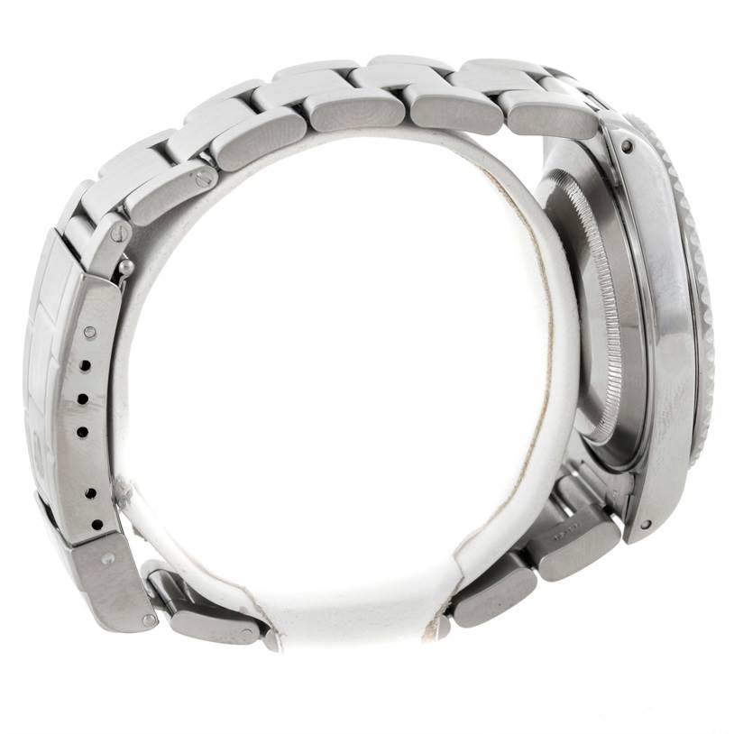 This image shows a side view of the Rolex Submariner 14060 Men
s Stainless Steel Black Dial 14060 Men
s Stainless Steel Black Dial watch, focusing on its stainless steel bracelet and case.