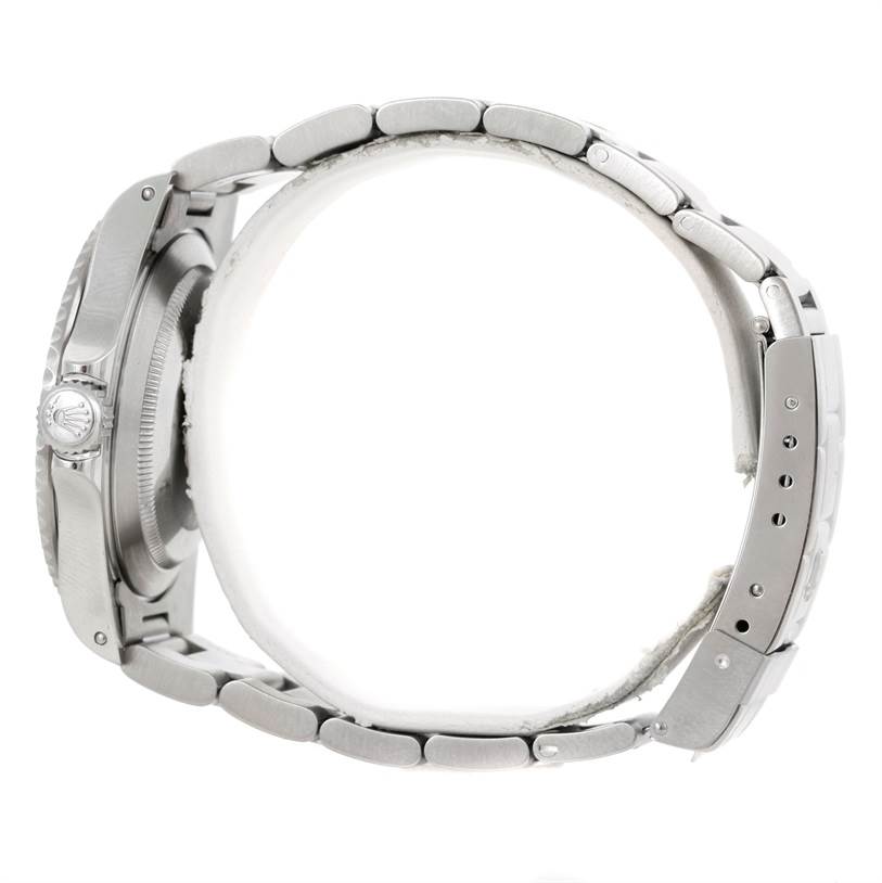 The image shows a side profile and partial back view of a Rolex Submariner 14060 Men
s Stainless Steel Black Dial 14060 Men
s Stainless Steel Black Dial model, featuring the bracelet and crown.