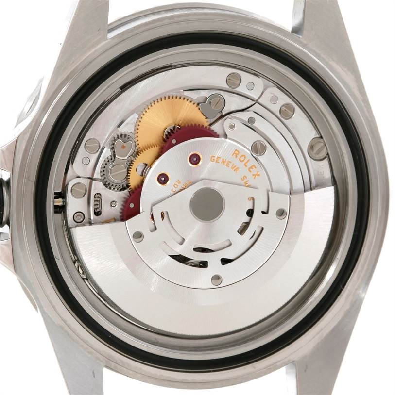 This image shows the back case of a Rolex Submariner 14060 Men
s Stainless Steel Black Dial 14060 Men
s Stainless Steel Black Dial, revealing the intricate internal movement and gears.