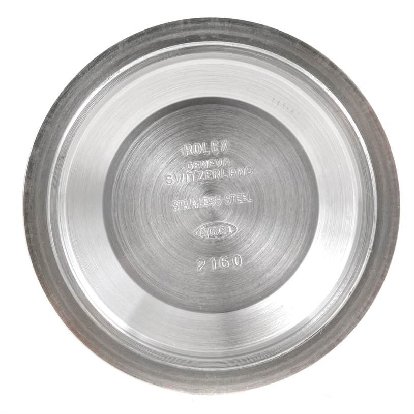 The image shows the inside case back of a Rolex Submariner 14060 Men
s Stainless Steel Black Dial 14060 Men
s Stainless Steel Black Dial watch, viewed from above.