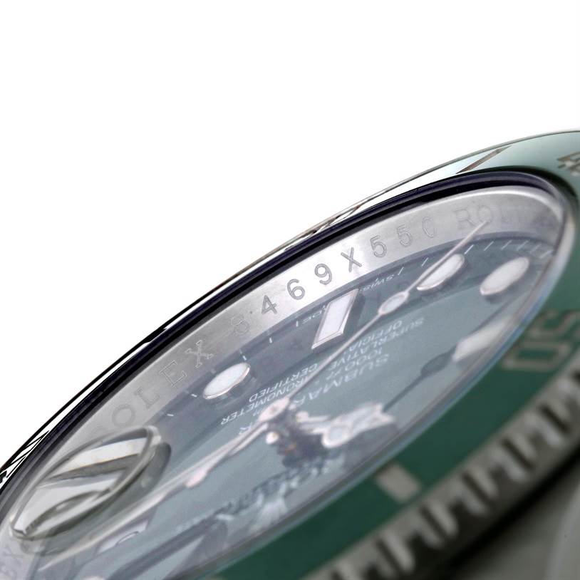 The image shows a close-up angle of the Rolex Submariner 116610LV Men's Stainless Steel Green Dial 116610LV Men's Stainless Steel Green Dial watch, highlighting the bezel, crystal, and partial watch face.
