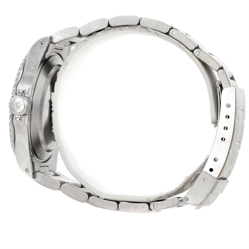 The image shows a side view of a Rolex Submariner 14060 Men
s Stainless Steel Black Dial 14060 Men
s Stainless Steel Black Dial, highlighting the crown, case, and bracelet.