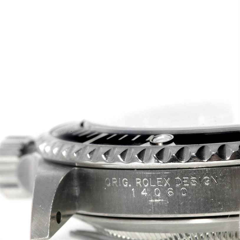 This side view of the Rolex Submariner 14060 Men
s Stainless Steel Black Dial 14060 Men
s Stainless Steel Black Dial shows the crown, bezel, and engraved model number (14060).