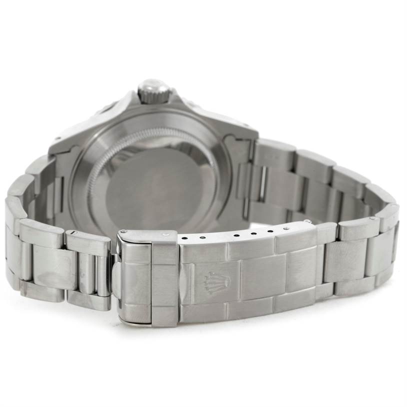 The image shows the back view of a Rolex Submariner 14060 Men
s Stainless Steel Black Dial 14060 Men
s Stainless Steel Black Dial watch, highlighting its stainless steel case and bracelet with a closed clasp.