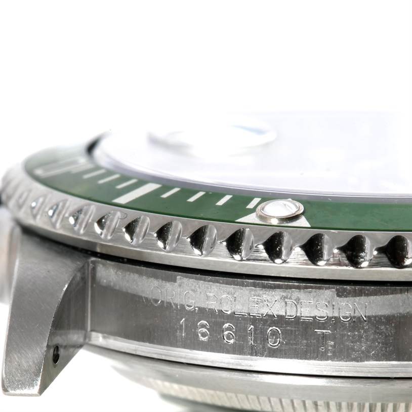 This image shows a side view of the bezel and part of the case of a Rolex Submariner 16610LV Men
s Stainless Steel Black Dial 16610LV Men
s Stainless Steel Black Dial watch, including the model number engraving.