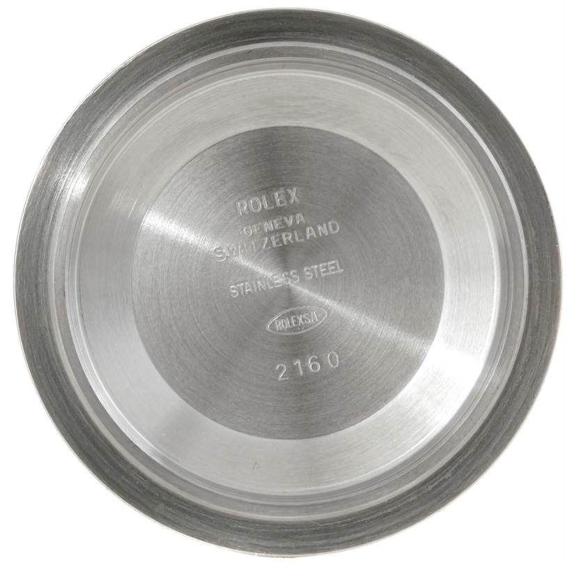 The image shows the inside of the case back of a Rolex Submariner 16610LV Men
s Stainless Steel Black Dial 16610LV Men
s Stainless Steel Black Dial watch, featuring engraved text.