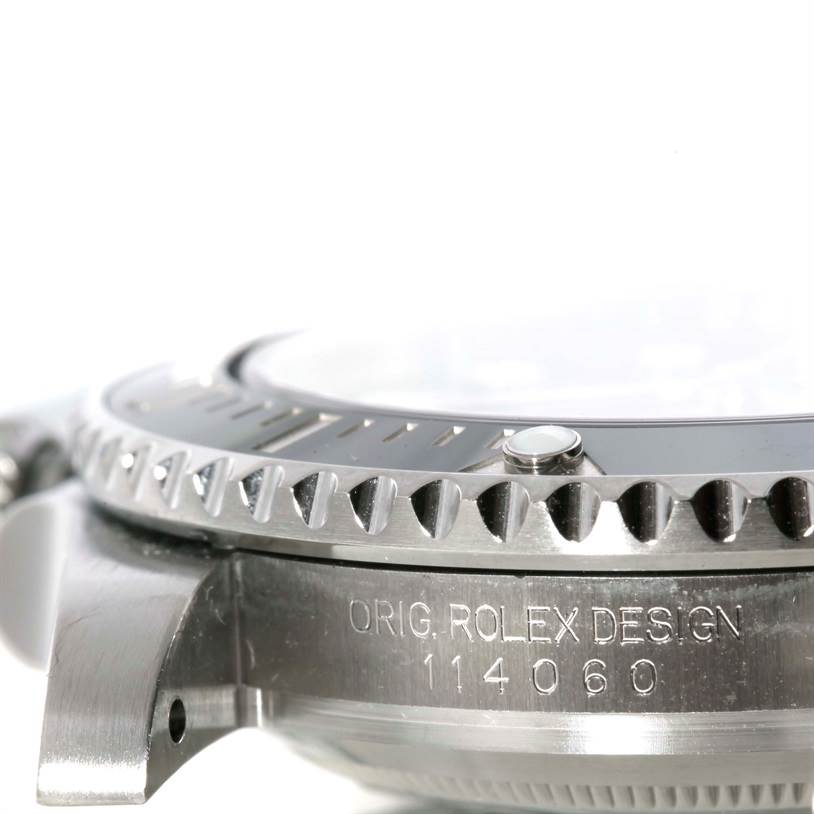 The image shows a close-up side view of the casing, bezel, and etched design number of a Rolex Submariner 114060 Men
s Stainless Steel Black Dial 114060 Men
s Stainless Steel Black Dial watch.