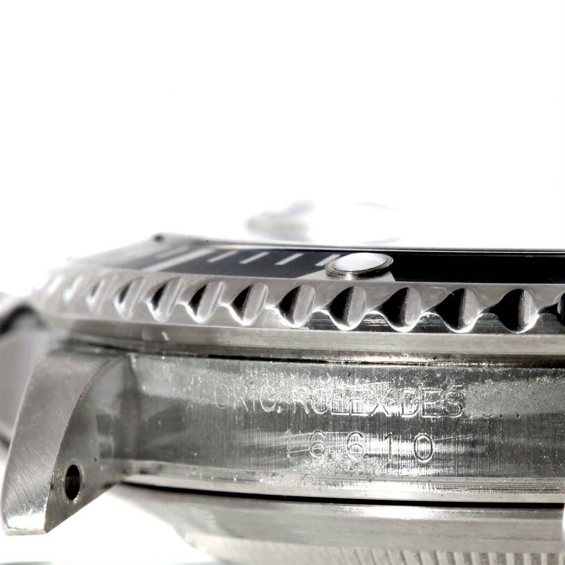 The image shows a close-up side view of the bezel and case of a Rolex Submariner 16610 Men
s Stainless Steel Black Dial 16610 Men
s Stainless Steel Black Dial watch.