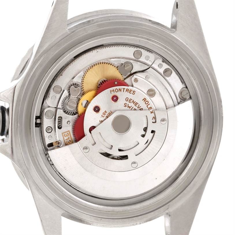 The image shows the back case removed, revealing the intricate movement parts of a Rolex Submariner 16610 Men
s Stainless Steel Black Dial 16610 Men
s Stainless Steel Black Dial watch.