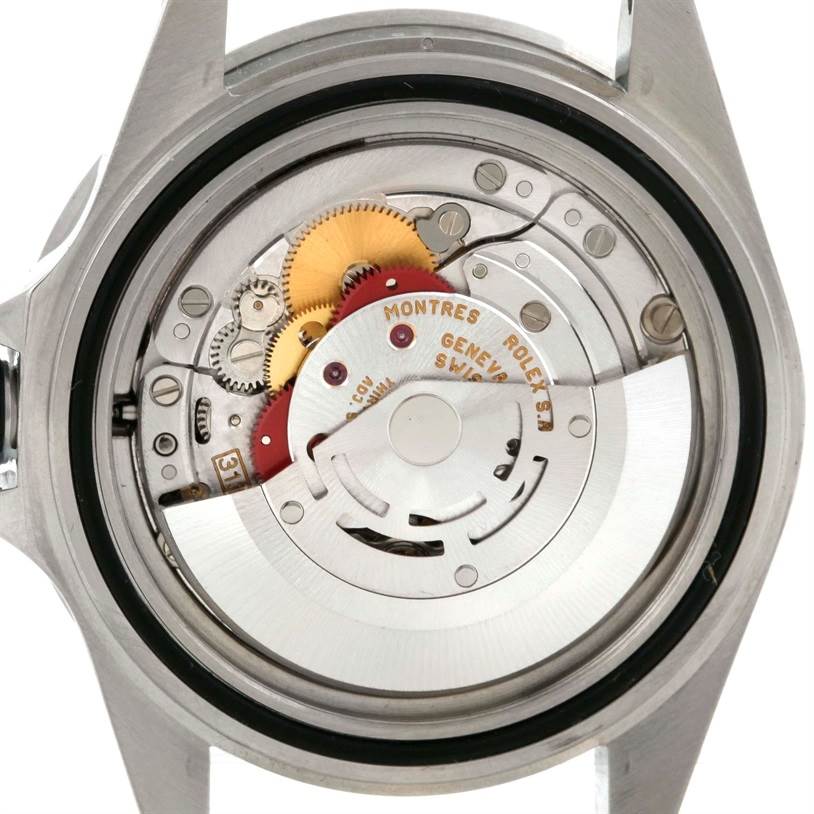 This image shows the back view of the Rolex Submariner 16610 Men
s Stainless Steel Black Dial 16610 Men
s Stainless Steel Black Dial watch, highlighting its internal mechanical parts and movement.