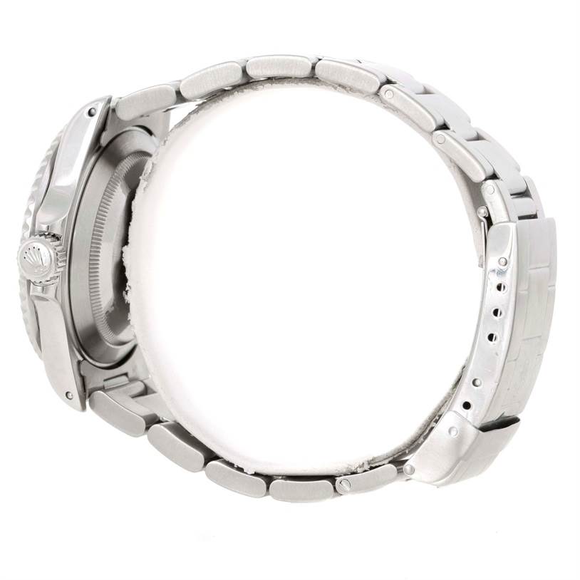 This image shows a side view of the Rolex Submariner 16610 Men
s Stainless Steel Black Dial 16610 Men
s Stainless Steel Black Dial watch, focusing on the bracelet and crown of the timepiece.