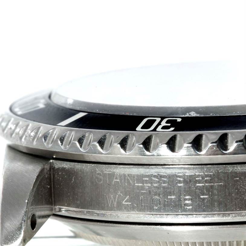 The image shows a close-up side view of the bezel and the stainless steel case of the Rolex Submariner 16610 Men
s Stainless Steel Black Dial 16610 Men
s Stainless Steel Black Dial watch.