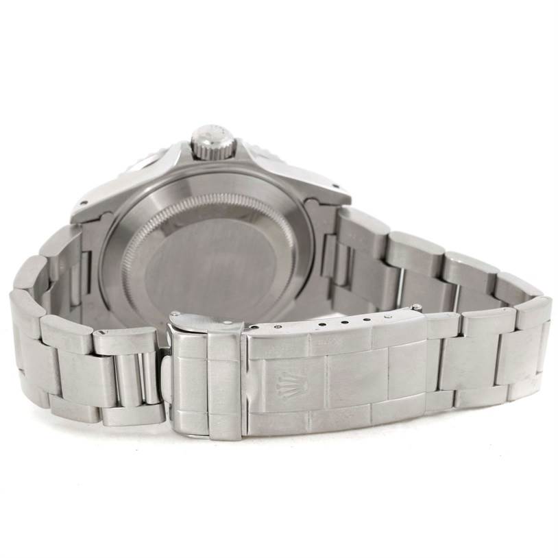 The image shows the back view of a Rolex Submariner 16610 Men
s Stainless Steel Black Dial 16610 Men
s Stainless Steel Black Dial watch, highlighting its caseback, bracelet, and clasp.