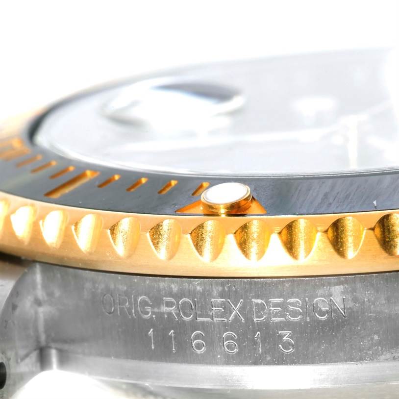 The image shows a close-up side view of the bezel and case of a Rolex Submariner 116613 Men's Steel and Gold (two tone) Black Dial 116613 Men's Steel and Gold (two tone) Black Dial, revealing the model number 116613.
