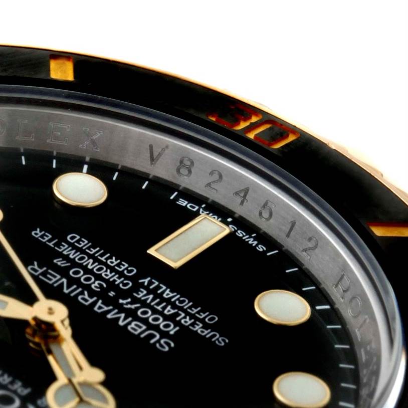 This close-up angle shows the dial, bezel, and part of the reference number of the Rolex Submariner 116613 Men's Steel and Gold (two tone) Black Dial 116613 Men's Steel and Gold (two tone) Black Dial watch.