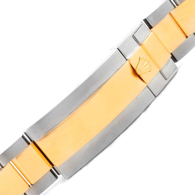 This image shows the gold-and-steel bracelet clasp of a Rolex Submariner 116613 Men's Steel and Gold (two tone) Black Dial 116613 Men's Steel and Gold (two tone) Black Dial watch.