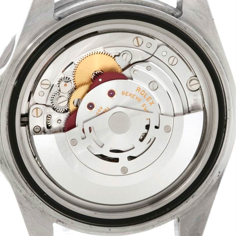 This is the back view of a Rolex Submariner 16610 Men
s Stainless Steel Black Dial 16610 Men
s Stainless Steel Black Dial watch, showcasing its internal movement and mechanical components.