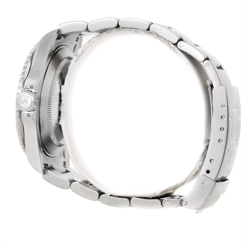 This image shows a side view of a Rolex Submariner 16610 Men
s Stainless Steel Black Dial 16610 Men
s Stainless Steel Black Dial, highlighting the bracelet, crown, and part of the case.