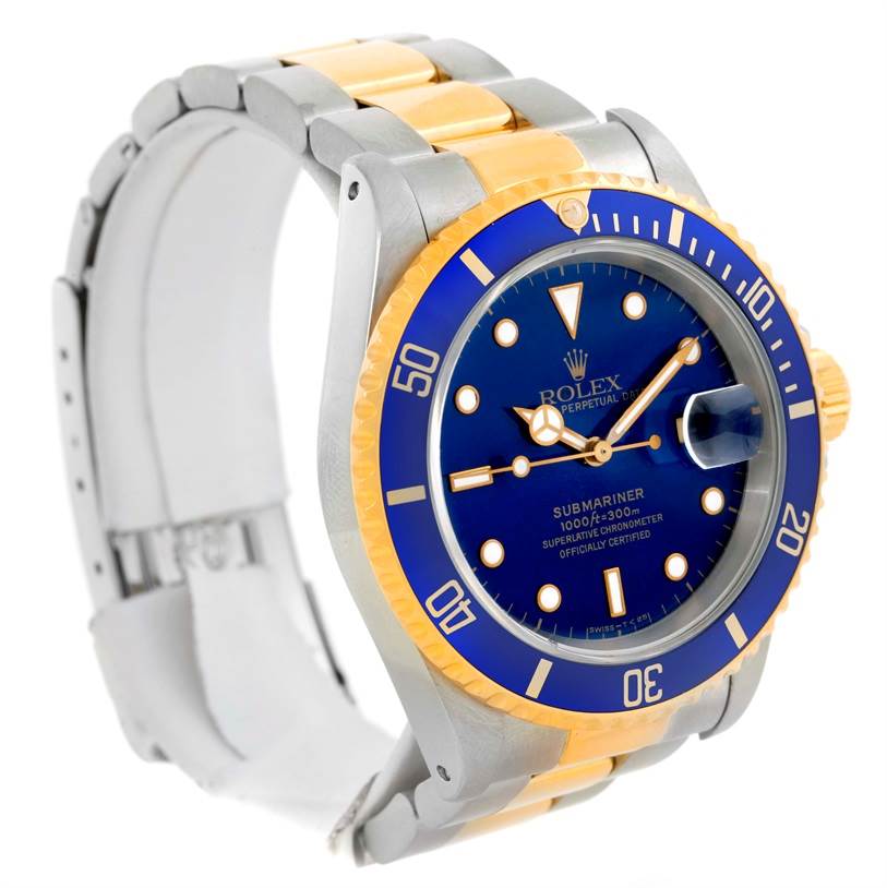 The image shows a Rolex Submariner 16613 Men's Steel and Gold (two tone) Blue Dial 16613 Men's Steel and Gold (two tone) Blue Dial watch at an angle highlighting the bezel, dial, crown, and bracelet.