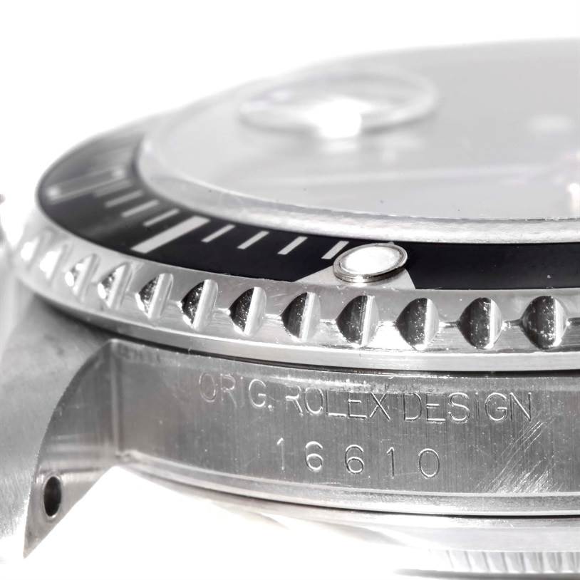 The image shows a close-up side view of the bezel and case of a Rolex Submariner 16610 Men
s Stainless Steel Black Dial 16610 Men
s Stainless Steel Black Dial, model number 16610.