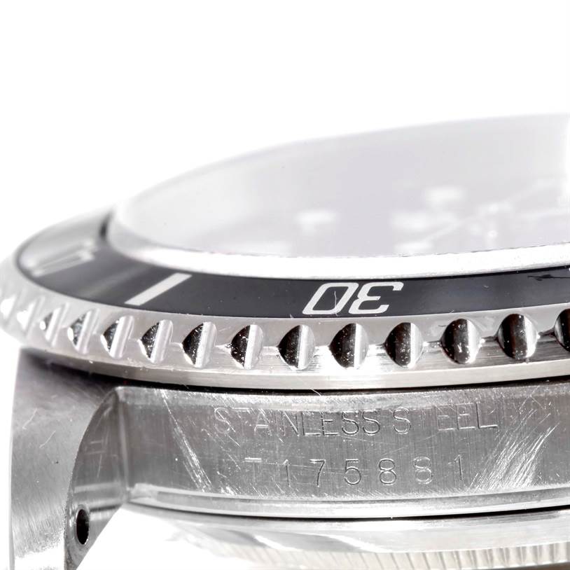 This close-up angle shows the bezel, crystal, and a part of the case of the Rolex Submariner 16610 Men
s Stainless Steel Black Dial 16610 Men
s Stainless Steel Black Dial watch.