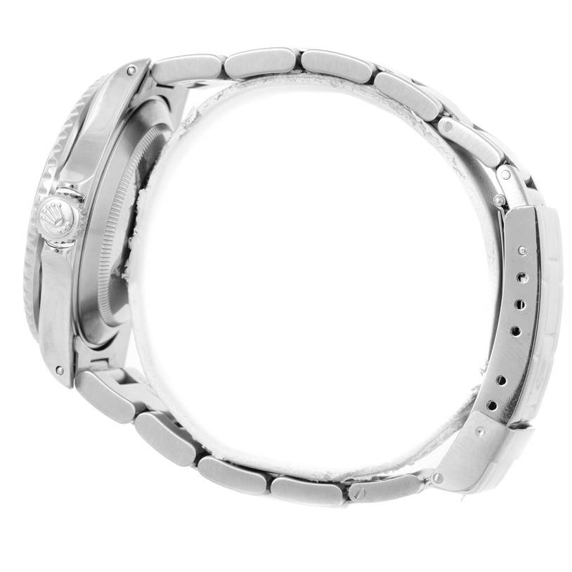 The image shows a side profile of a Rolex Submariner 16610 Men
s Stainless Steel Black Dial 16610 Men
s Stainless Steel Black Dial watch, highlighting the crown, case, and bracelet.