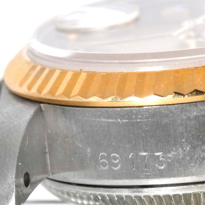 The image shows a close-up side view of a Rolex Datejust 69173 Women's Stainless Steel Champagne Dial 69173 Women's Stainless Steel Champagne Dial watch, including the fluted bezel and part of the stainless steel case with the model number "69173."