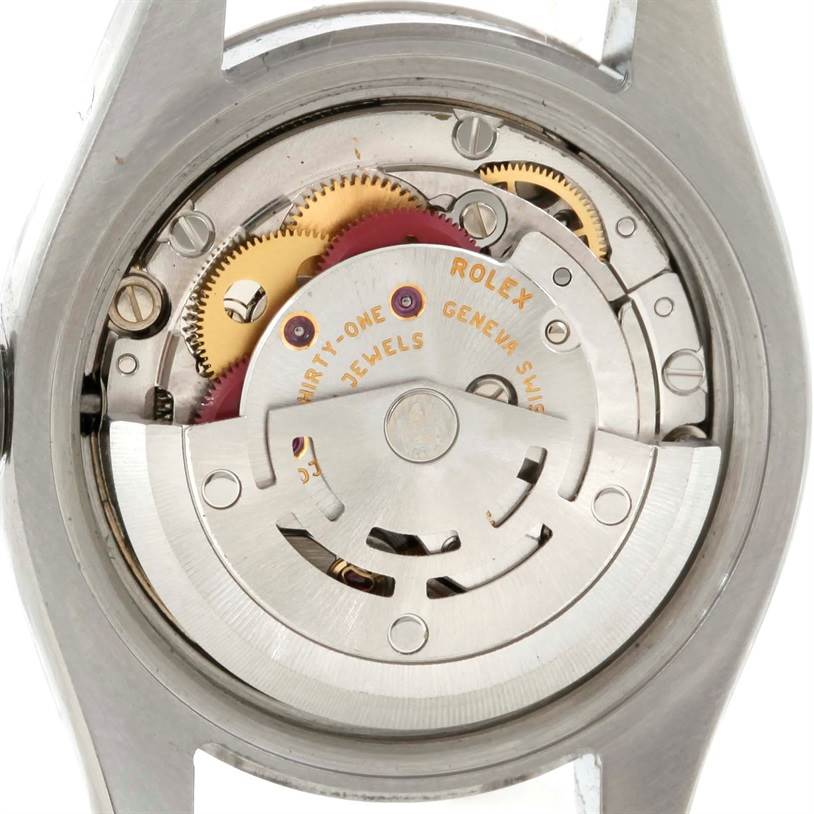 This image shows the back view of a Rolex Datejust 179174 Women
s Stainless Steel Silver Dial 179174 Women
s Stainless Steel Silver Dial watch, revealing its intricate internal mechanical movement.
