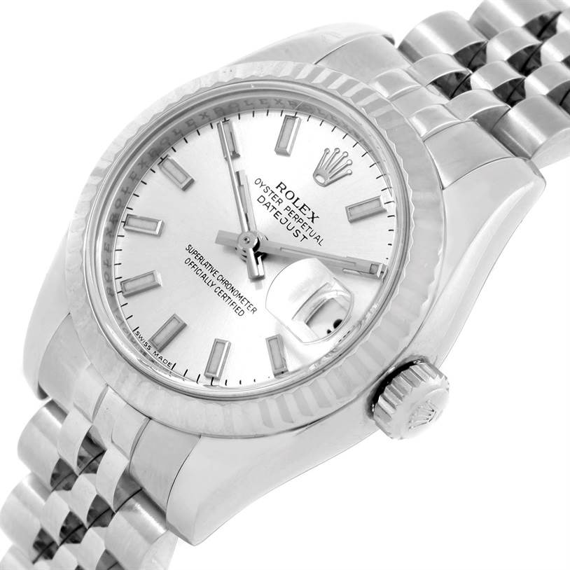 The image shows a close-up angle of the Rolex Datejust 179174 Women
s Stainless Steel Silver Dial 179174 Women
s Stainless Steel Silver Dial watch, highlighting its face, crown, and part of its bracelet.