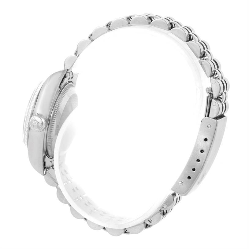 The image shows a side view of a Rolex Datejust 79174 Women's Stainless Steel White Dial 79174 Women's Stainless Steel White Dial watch, highlighting the crown, case, and part of the bracelet.