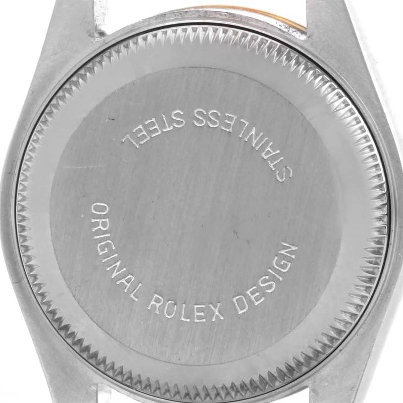 The image shows the case back of a Rolex Datejust 69173 Women's Stainless Steel Champagne Dial 69173 Women's Stainless Steel Champagne Dial watch, emphasizing the "STAINLESS STEEL" and "ORIGINAL ROLEX DESIGN" engravings.