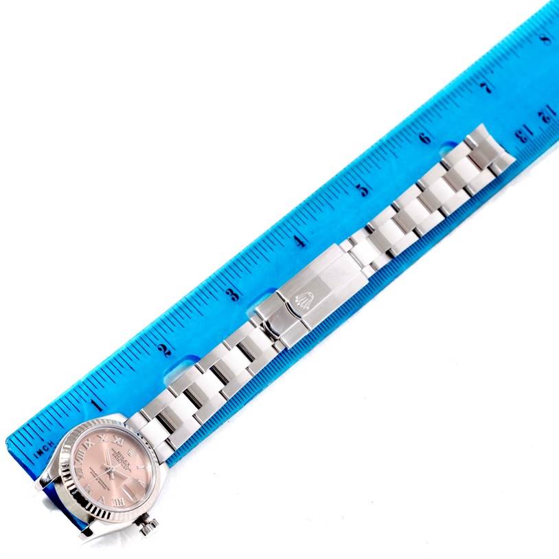 The image shows the Rolex Datejust 179174 Women's Stainless Steel Pink Dial 179174 Women's Stainless Steel Pink Dial watch lying flat with a blue ruler, displaying the band and partially the watch face.