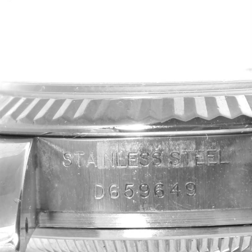 The image shows the stainless steel case and serial number of a Rolex Datejust 179174 Women's Stainless Steel Pink Dial 179174 Women's Stainless Steel Pink Dial watch, viewed from a close angle.