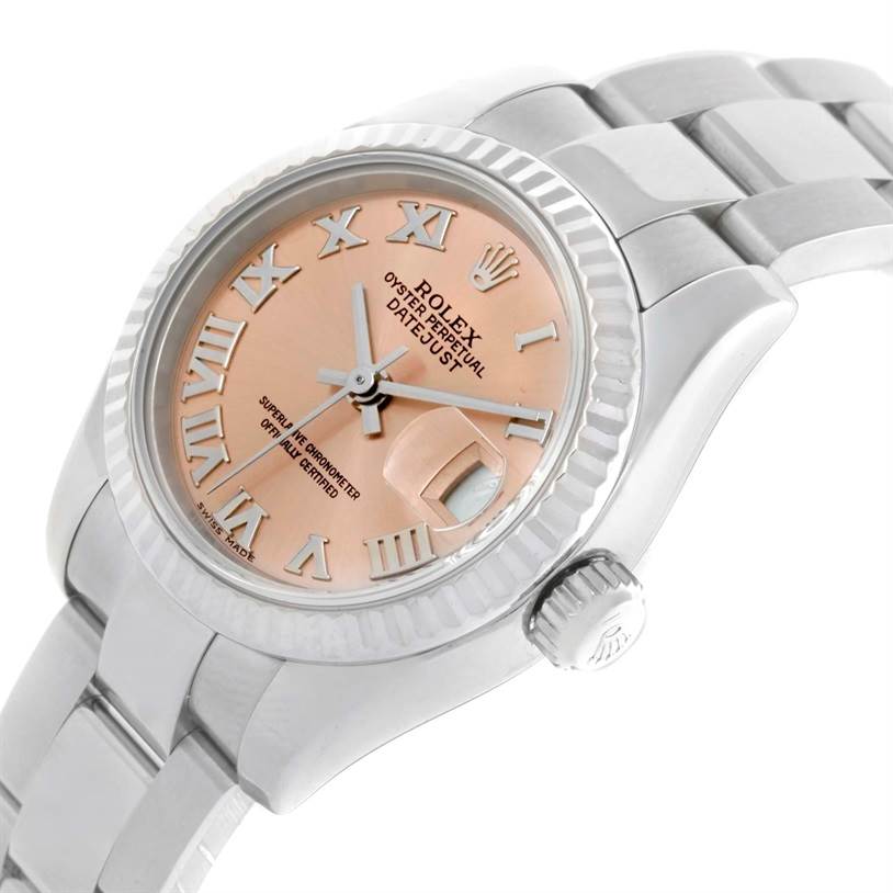 The Rolex Datejust 179174 Women's Stainless Steel Pink Dial 179174 Women's Stainless Steel Pink Dial watch is shown at a slight angle, displaying the face, Roman numerals, bezel, and part of the bracelet.