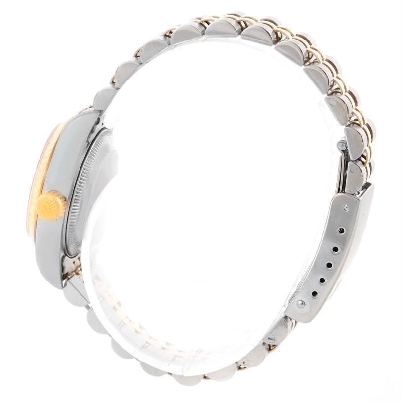 This image shows a side view of a Rolex Datejust 69173 Women's Stainless Steel Champagne Dial 69173 Women's Stainless Steel Champagne Dial watch, highlighting its crown, case, and bracelet.