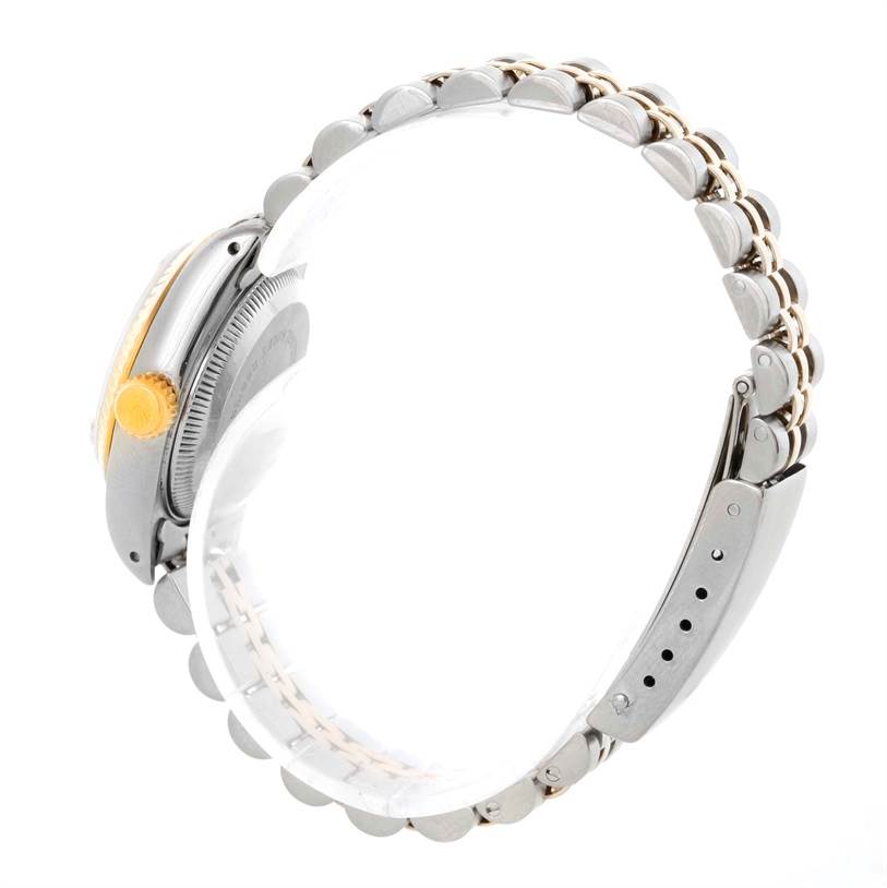 The image shows the side view of a Rolex Datejust 69173 Women
s Stainless Steel White Dial 69173 Women
s Stainless Steel White Dial watch, highlighting the crown, case, and metal bracelet.