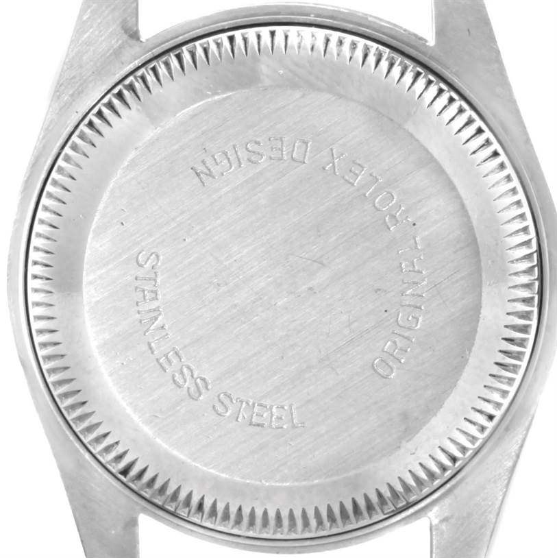 This image shows the back cover of a Rolex Datejust 69173 Women
s Stainless Steel White Dial 69173 Women
s Stainless Steel White Dial watch, displaying "Stainless Steel" and "Rolex Design" engravings.